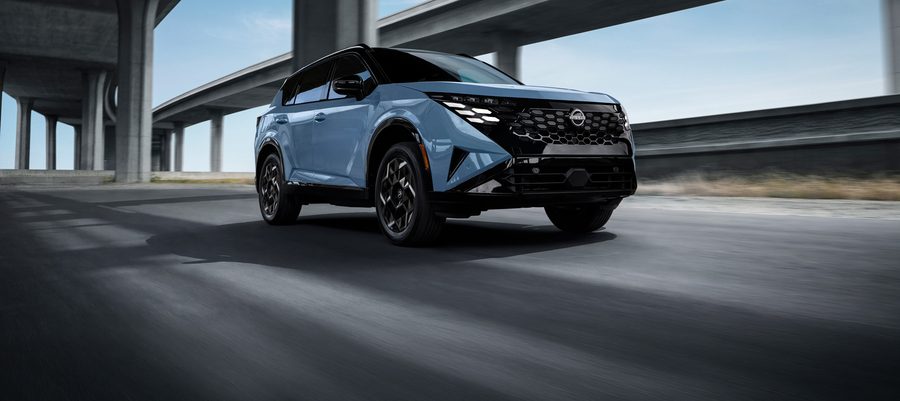 2027 nissan rogue hybrid in motion front view xl